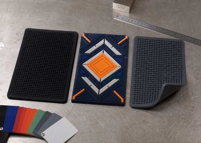 A detailed comparison of rubber vs PVC vs silicone bar mats laid out side-by-side