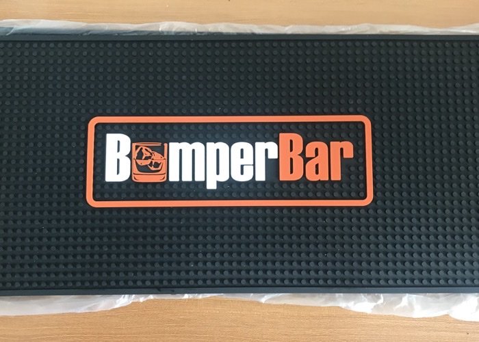Custom Bar Mat Manufacturing A custom black and white bar mat from an original manufacturer of bar mat, showing precise logo details.